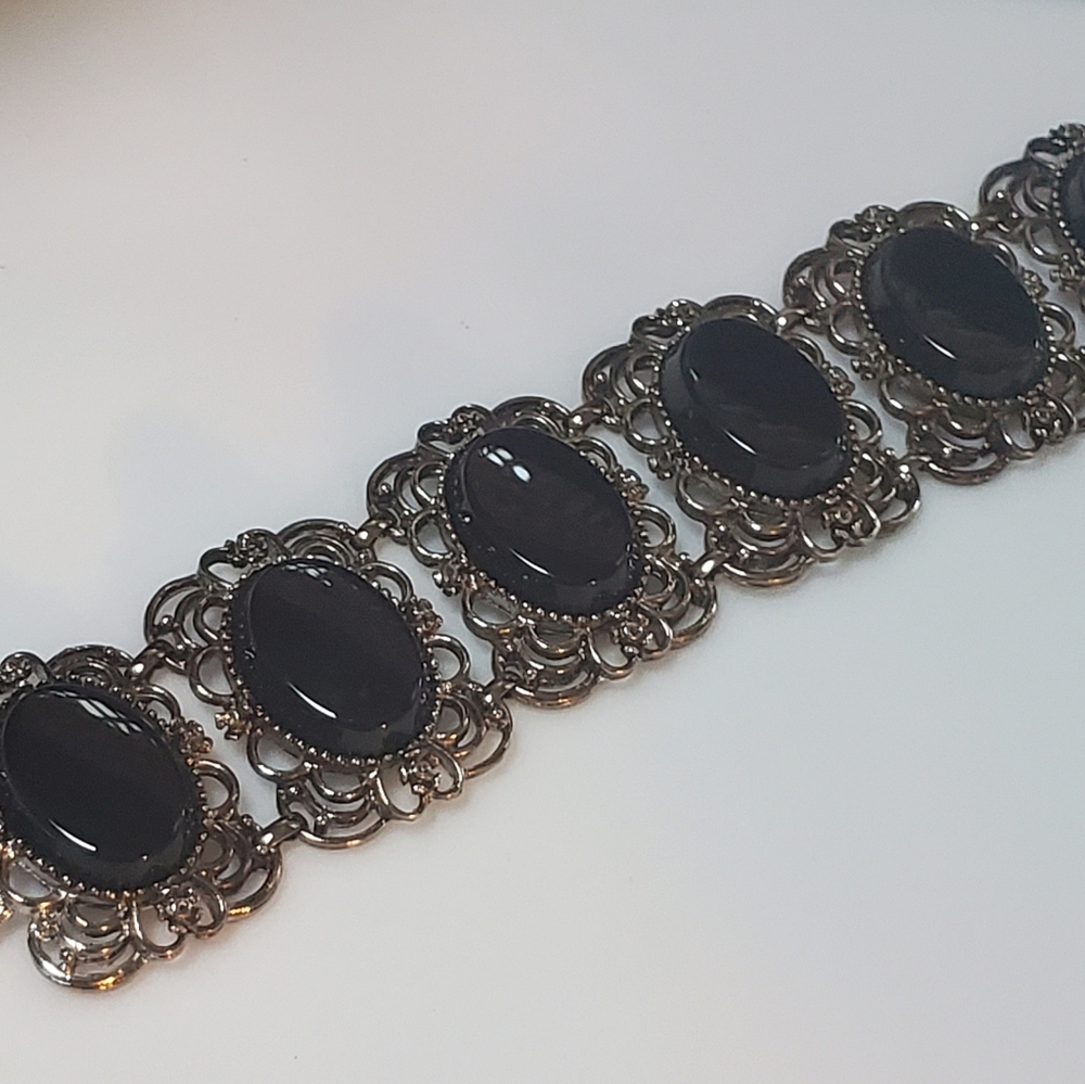 Vintage book panel bracelet.  Silver toned with black stones.